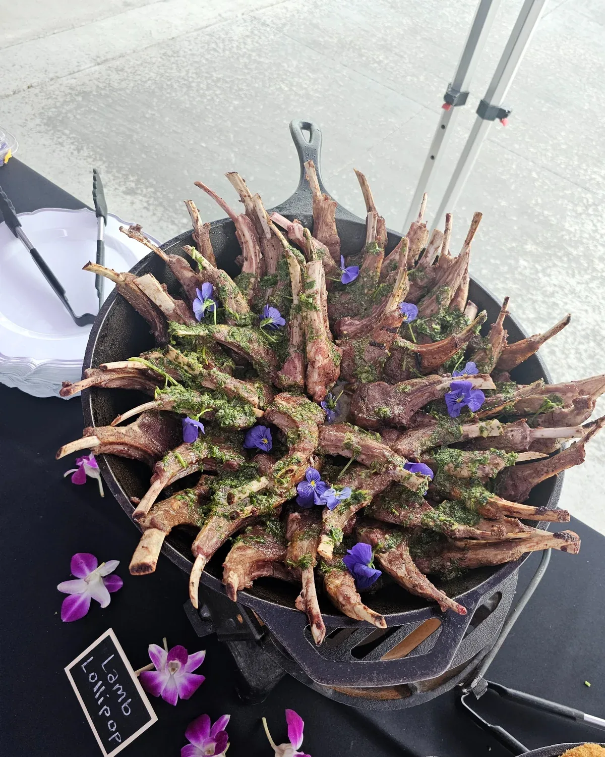Herb-finished lamb lollipops presented for event service
